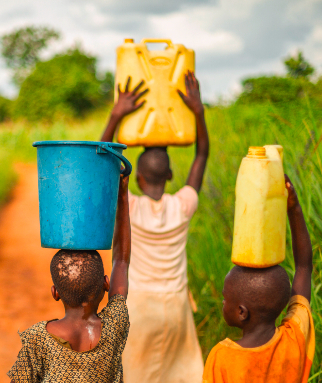 Village black children with water buckets on their heads 4